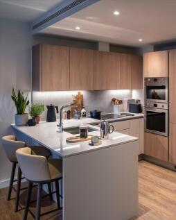 Experience a blend of style and function in this chic kitchen space.