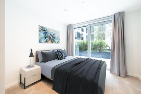 Experience tranquility in this beautifully designed bedroom featuring sleek furnishings and ample natural light.