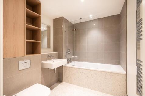 Immerse yourself in this chic bathroom design, offering comfort and style.