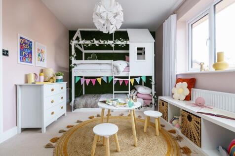 The spacious second double bedroom boasts masses of natural light