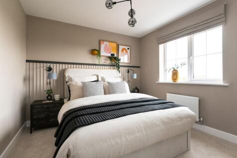 The luxurious main bedroom offers an idyllic place to relax
