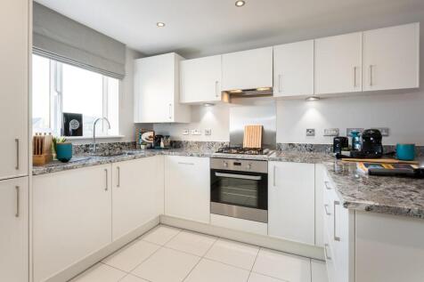 Overlooking the front, the kitchen has plenty of storage space
