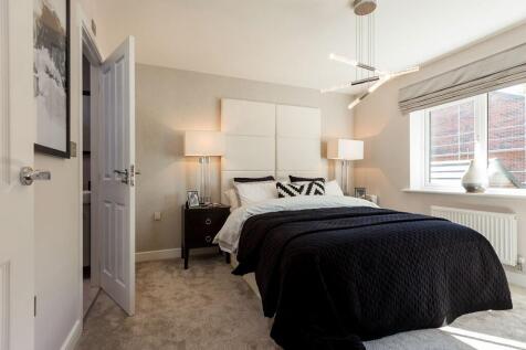 A spacious main bedroom with wardrobe space