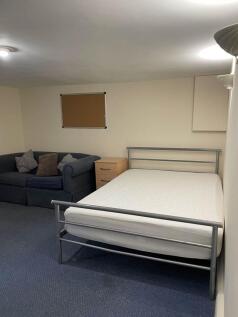 Well-presented double bedroom with a metal-fram...