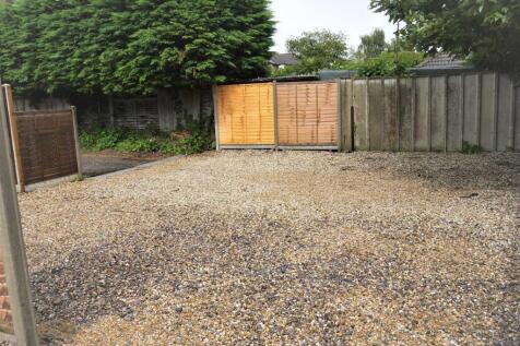 Gravelled outdoor area with secure timber fenci...