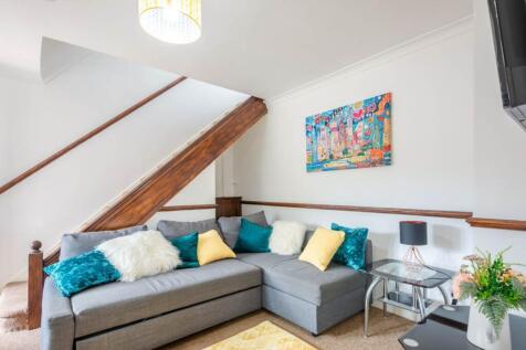 Bright, inviting living room with a comfortable...