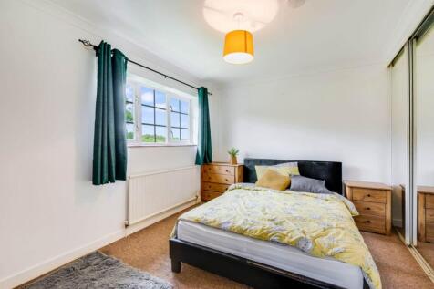 Bright, neatly presented bedroom with a double ...