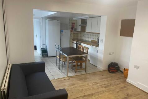 Bright open-plan living and kitchen area with w...