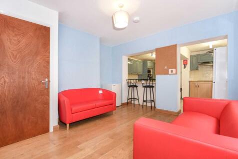 Bright communal living area with contemporary s...