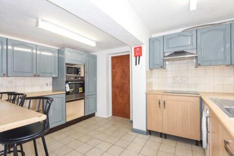 Bright, well-equipped kitchen with plentiful ca...