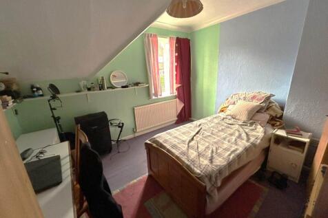 Cozy single bedroom with a comfortable bed, bed...