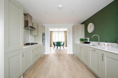 An open plan kitchen and dining area creates space to entertain