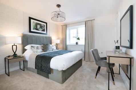 The main bedroom has plenty of space for a desk or dressing table
