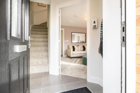 The entrance hallway leads to the lounge