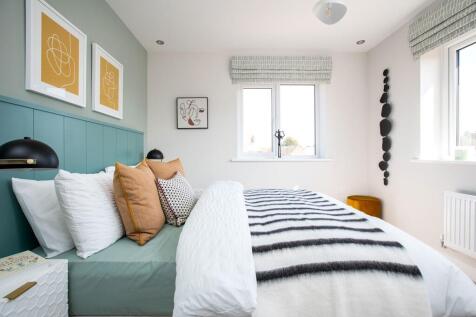 Windows in bedroom 2 flood the room with natural light