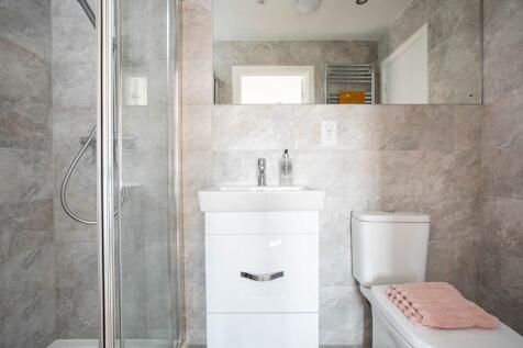 The main bedroom boasts its own en suite shower room