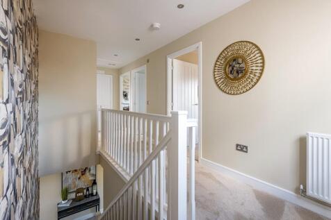 Bright landing leading to the bedrooms