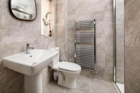 The main bedroom also hosts a private en-suite shower room