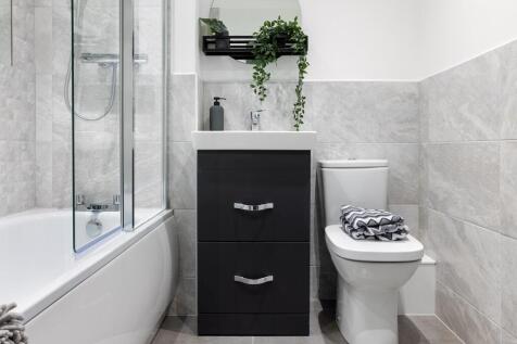 Family-friendly bathroom with shower over bath