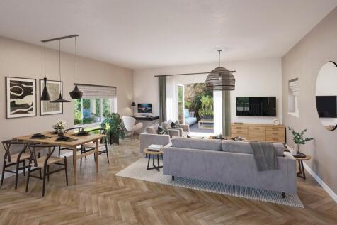 Open plan kitchen diner and lounge space with french doors