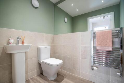 The ground floor is completed with a guest cloakroom