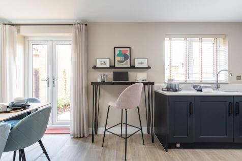 Add a breakfast bar or working space to the kitchen
