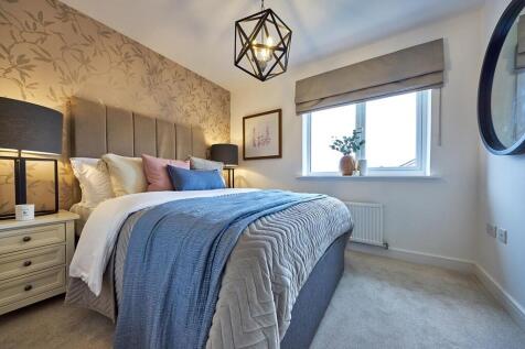The main bedroom is welcoming and inviting