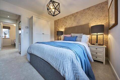 Relax after a long day in the main bedroom