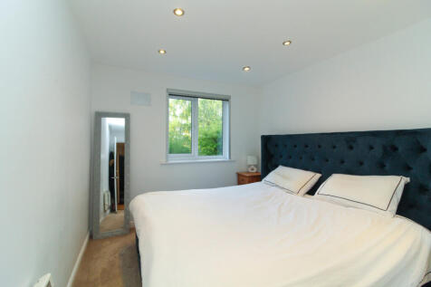 Bedroom with views over communal grounds