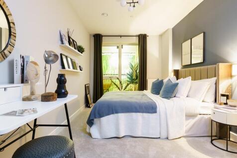 Large bedroom with double doors onto a private balcony