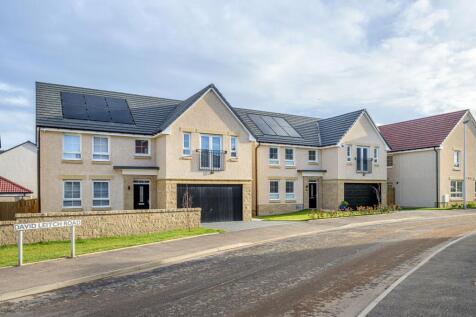 Street of detached 4 bed homes