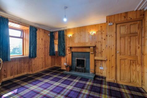 Lounge 2 with open fire and back boiler.