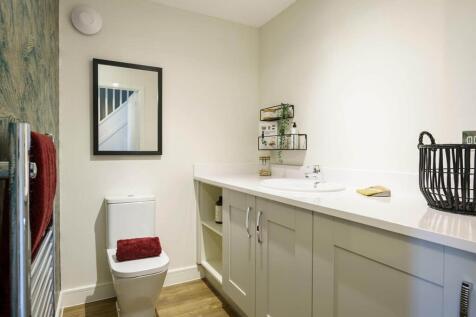 A guest cloakroom completes the ground floor