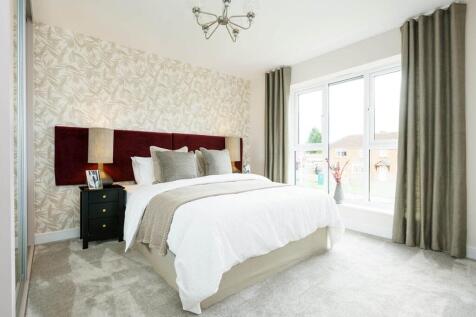 The spacious main bedroom offers the perfect space to unwind