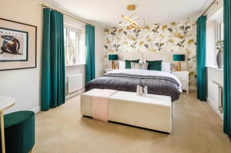The spacious main bedroom offers a place to unwind away from the rest of the home