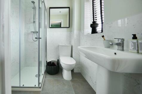 Bedroom 1 also hosts a private en suite shower room