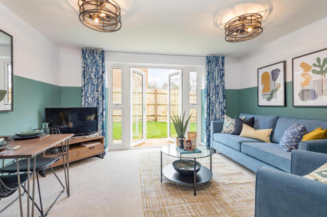 Lounge with french doors to the garden in the Belmont, 2 bedroom home at St George&#39;s Gate, Newport