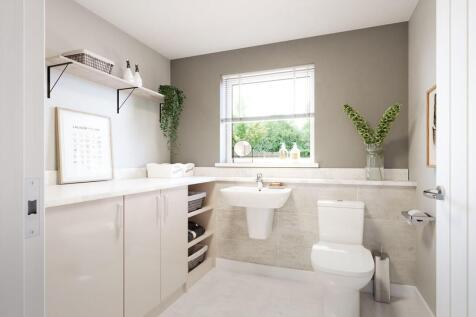 A downstairs toilet and utility room adds convenience