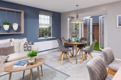 Internal view of a large open plan kitchen with french doors