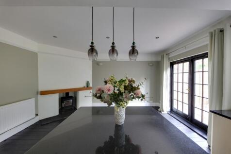 view to dining area and log burner