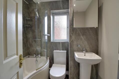 Family bathroom with over bath shower