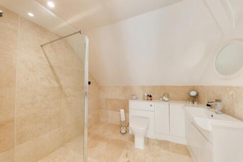 large ensuite with partial wet room plumbing