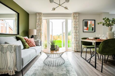 The kitchen/dining area boasts double doors out to the garden