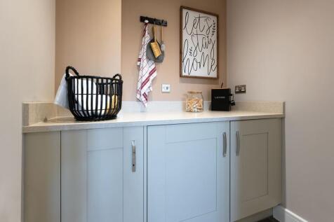Utility with additional storage and space for laundry