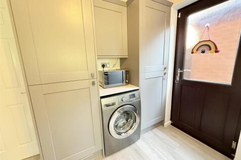 Fitted Kitchen With Utility Area
