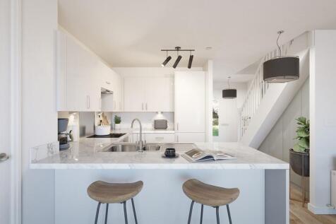 The kitchen features a sociable breakfast bar
