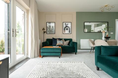 The living area features double doors leading out onto a balcony or terrace area