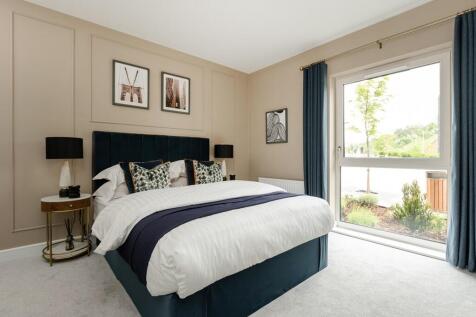 The stunning main bedroom offers plenty of space and light