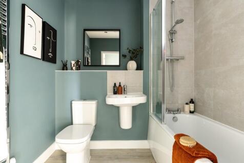 The main bathroom features  modern energy saving fixtures and fittings