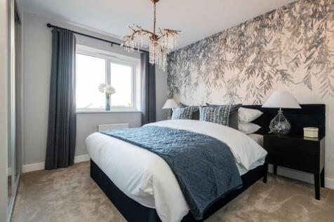 The king-size main bedroom has ample space for storage